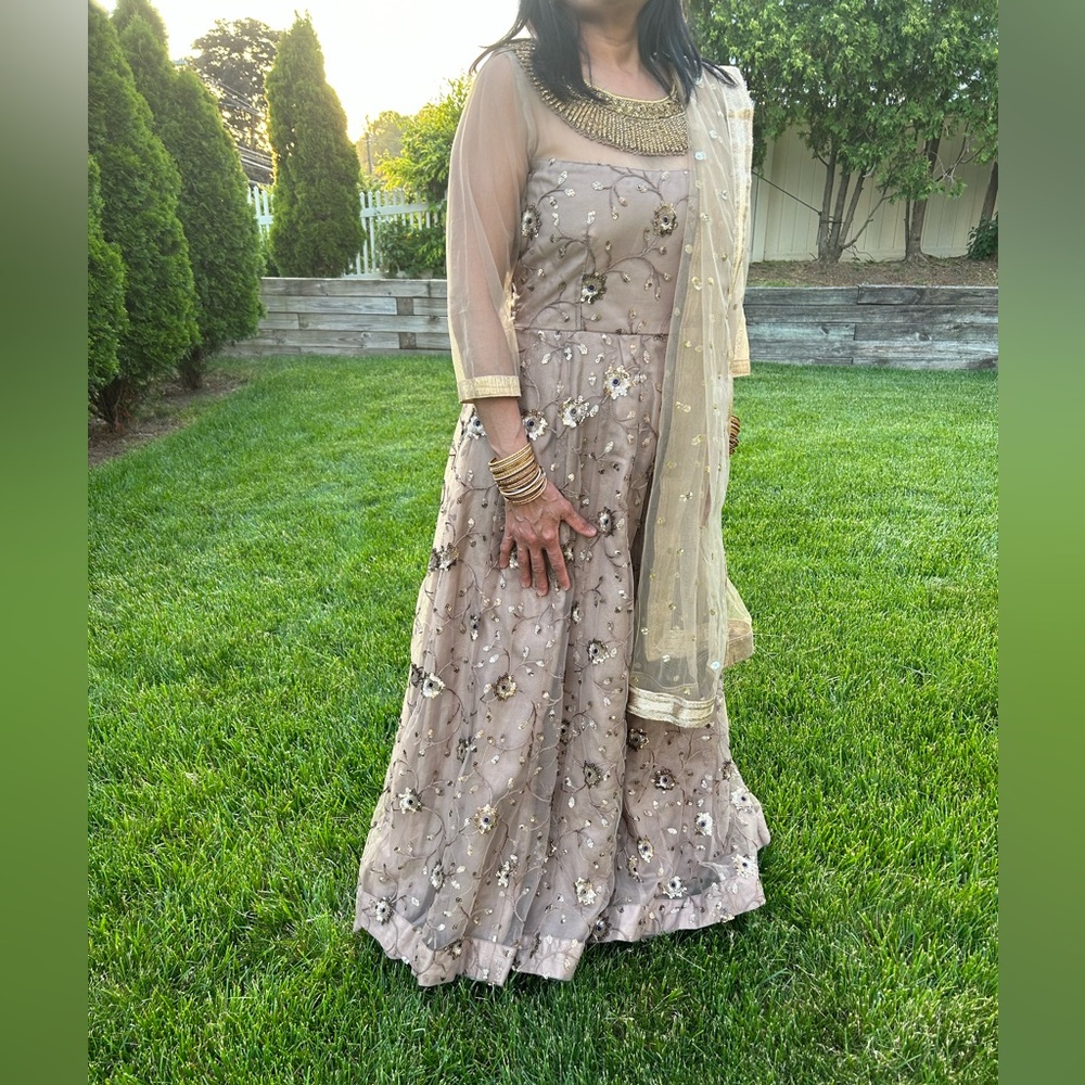 Elegant beige gown/lehenga with intricate work